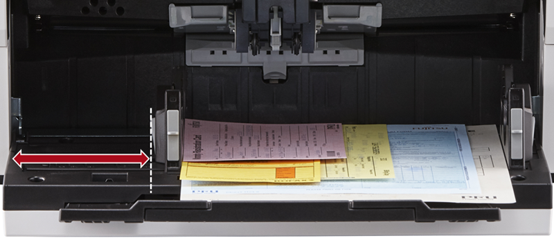 Independent Side Guides Image showing various sized documents loaded into the feeder tray with a red arrow highlighting the side guide pushed up against the stack of documents keeping them aligned neatly